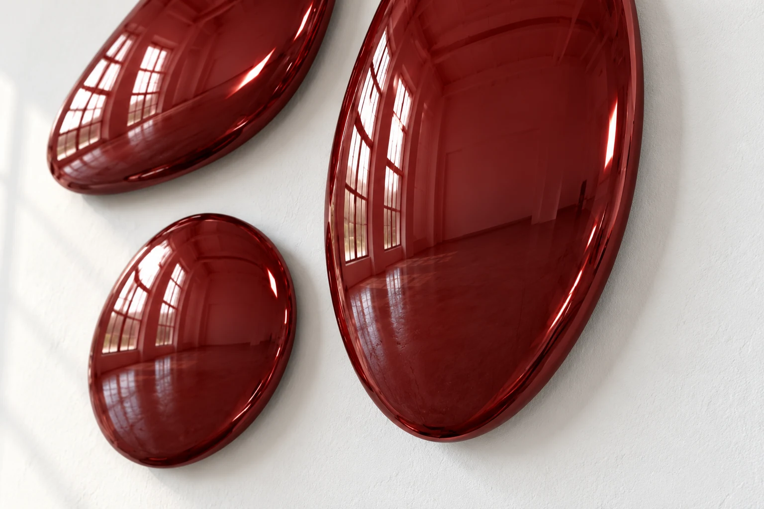 Close view of the surface of three curved forms